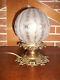 Ancienne lampe à poser laiton, bronze et globe en verre